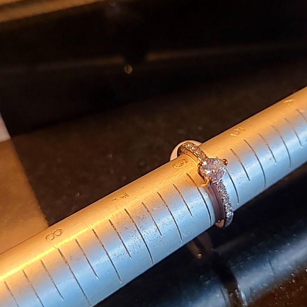 Real silver , side diamonds are real , big diamond is CZ